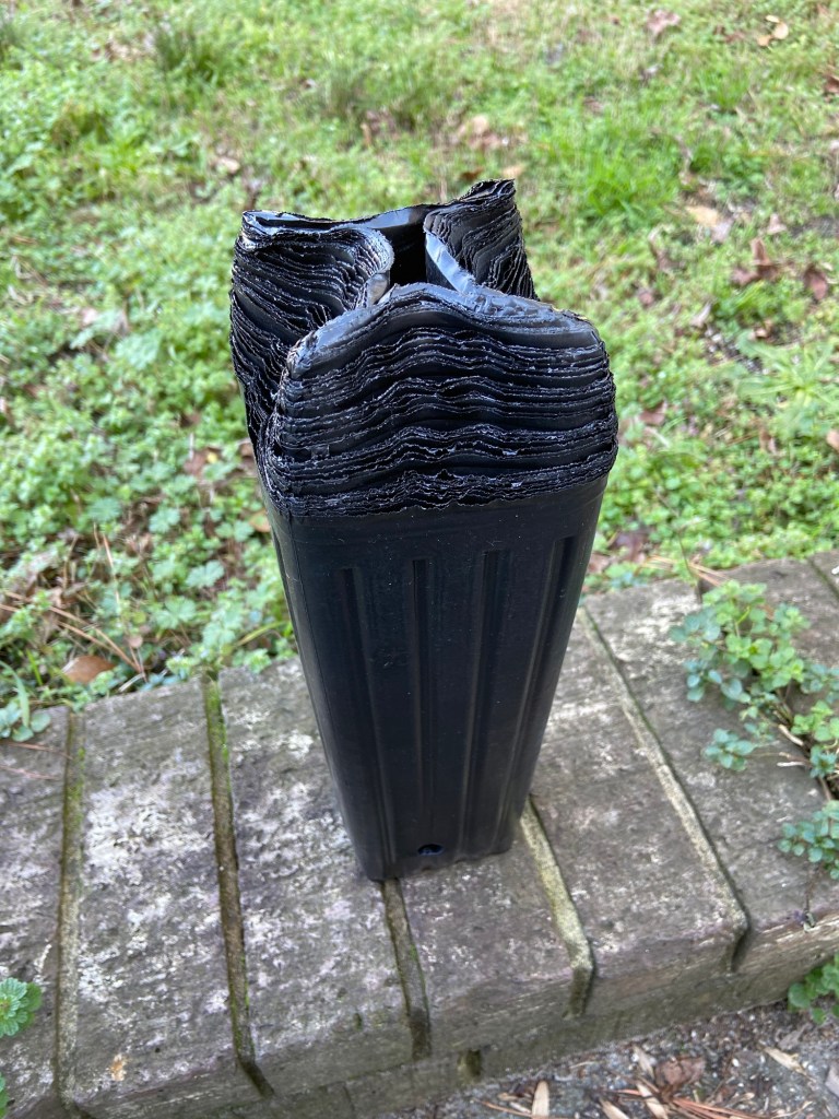 A photo showing the purchased 12 inch tree pots, all stacked together.